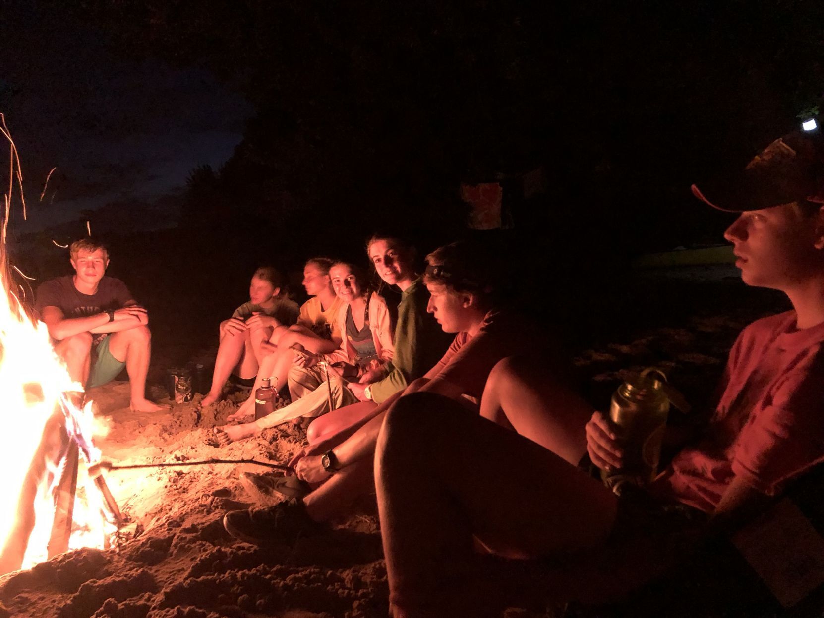 The Scheidts and others at a campfire